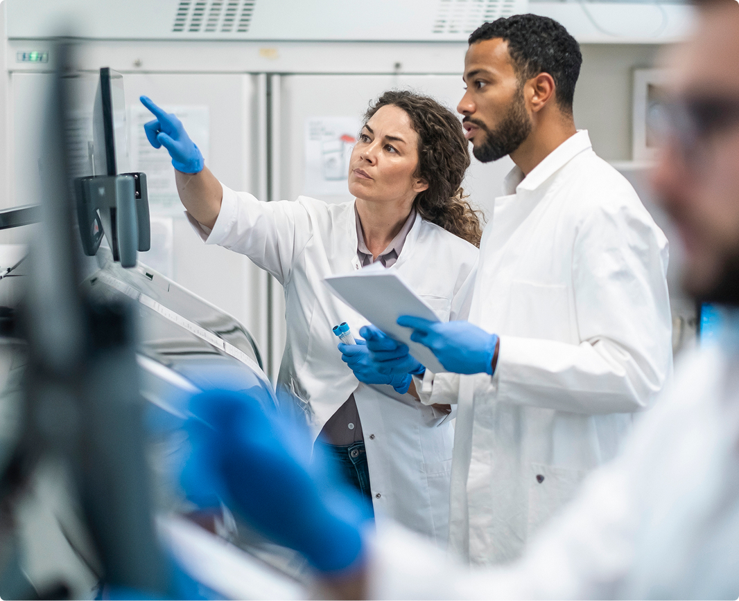 Pharmacists reviewing quality data in the lab
